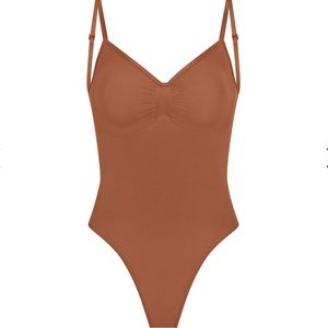 SKIMS Seamless Sculpt Low Back Thong Bodysuit in Bronze